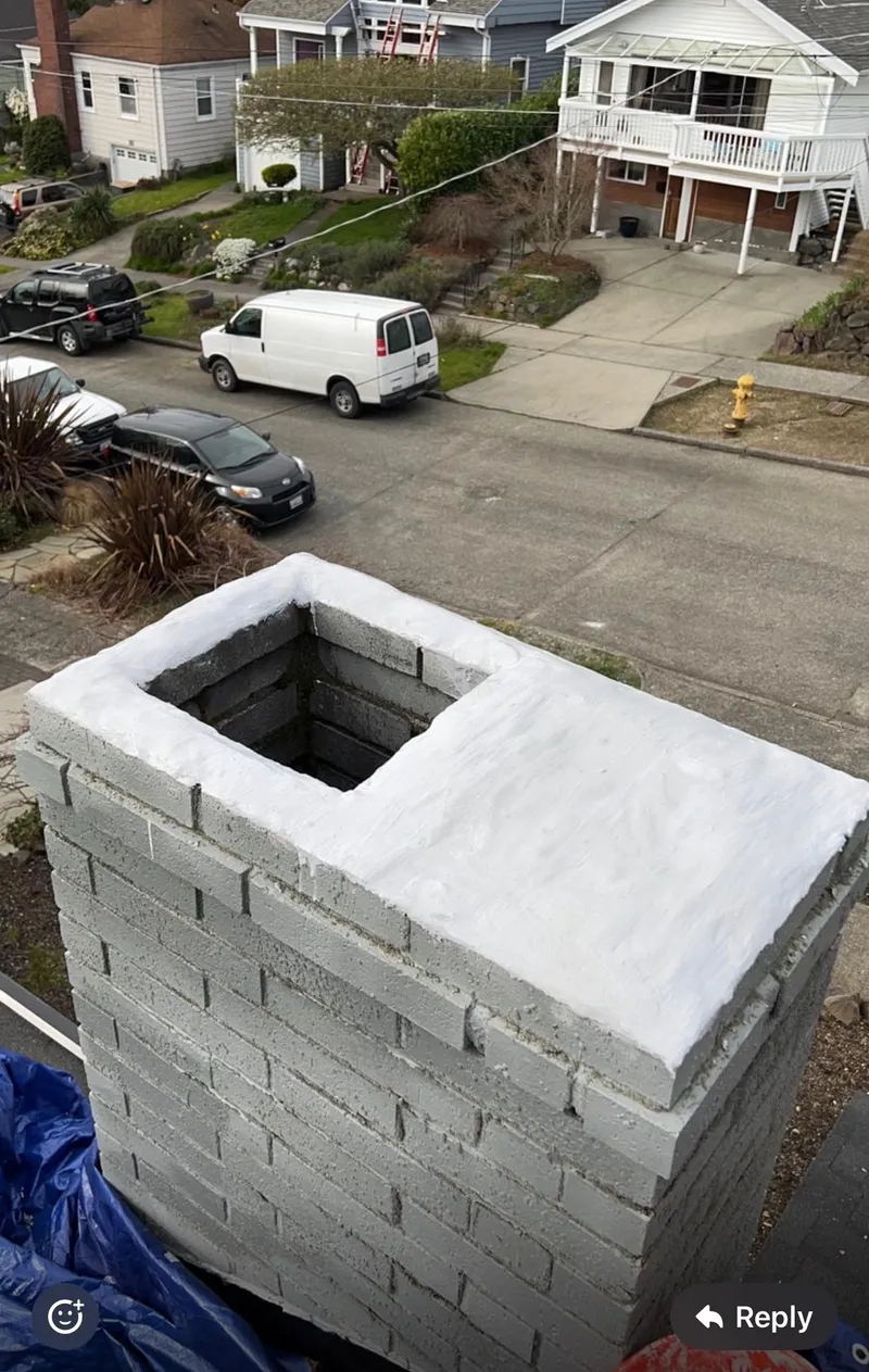 Newly rebuilt block chimney after complete chimney reconstruction on Eastside home