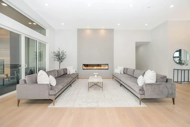 Gas fireplace in an Issaquah living room — warm, well-lit interior with stone surround