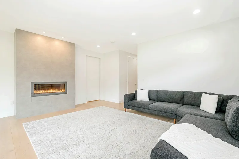 Modern gas fireplace installed in a Bellevue living room with clean surround and warm lighting