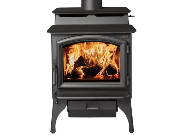 Lopi Cape Cod wood stove on a stone hearth pad in a Kirkland living room